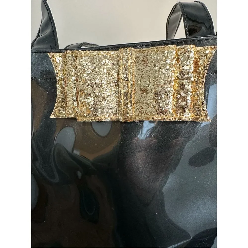 Ted Baker London Icon vinyl handbag with gold bow.    M-0927